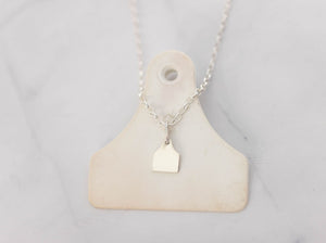 Small Cow Ear Tag Pendant from Chele Clarkin Jewellery