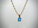Blue Topaz with Horseshoes Pendant | 9ct Yellow Gold