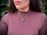Blue Topaz with Horseshoes Pendant | 9ct Yellow Gold